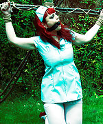 Redhead nurse in outdoor bondage